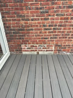 Front entryway of a home with color-matched brick stain